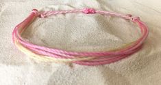 Super cute Pura Vida style waxed string stackable bracelets. Lots of colors available (see photos). Please see photos for bracelet examples and note your color number(s) in the Personalization box. Feel free to send me a message &/or picture if you would like to design your own! 😊 Thank you!! ❤️ 🌴 🌞 🌺 🌊 ️ 🏝 ⛱ 👙 🐠 Adjustable Pink Stackable Friendship Bracelets, Adjustable Stackable Pink Friendship Bracelets, Casual Pink Stackable Jewelry, Adjustable Cute Bangle Friendship Bracelets, Cute Adjustable Bangle Friendship Bracelets, Hypoallergenic Pink Friendship Bracelets For Beach, Casual Pink Stackable Friendship Bracelets, Basic Bracelet, Surfer Bracelets