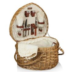 a wicker picnic basket with utensils in it