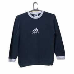 "Vintage Adidas Golf embroidered logo sweatshirts medium size (PLEASE CHECK THE MEASUREMENTS BELOW CAREFULLY) ACTUAL SIZE MEASUREMENT ARM PIT TO ARM PIT:- 20\"inches BACK COLLAR TO HEM:-27 \"INCHES WE ARE USING DHL FOR POSTAGE. PLEASE LEAVE YOUR PHONE NUMBER ON THE NOTE WHILE MAKE A PURCHASE. Etc: Don't Worry About Customs Tax or Fees. I usually Declare all Items as 'Gift' & Declare Value of Item Lower than Original Price. All Items are Sold \"AS IS\" so Please be Sure to Read The Entire Description and Look at All The Pictures. Any Question and More Details Please Don't Hesitate to Contact Me." College Crew Neck Sweatshirt With Logo Detail, Sporty Crew Neck Sweater With Logo Detail, Sporty Crewneck Sweater With Embroidered Logo, Sporty Crew Sweatshirt With Embroidered Logo, Sporty Crew Sweats With Embroidered Logo, Sporty Crew Neck Sweater With Embroidered Logo, Athleisure Crew Sweatshirt With Embroidered Logo, Athleisure Crew Neck Sweatshirt With Embroidered Logo, Sportswear Cotton Sweatshirt With Embroidered Logo