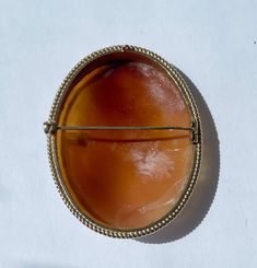 A large oval gold mounted cameo of unusual composition.  The yellow gold casing is excellent, made in the traditional style with the form following the shape of the shell.  It is fully hallmarked for Birmingham 1975 . Goldsmiths mark could be RS but it is all rather small.  Edged in gold wirework. The cameo is very finely carved & probably Italian. It is possibly older than the gold frame which has been made to fit.  An unusual composition which looks to be based on a print by Raphael. The size Cameo Brooch, Wire Work, Gold Frame, Traditional Style, Birmingham, Dolphins, Favorite Jewelry, Brooches, Shells