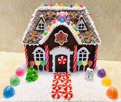 a gingerbread house decorated with candy and candies