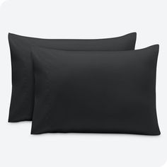 two black pillow cases sitting next to each other