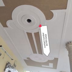 the ceiling is painted white and has a red arrow pointing to the right with an arrow pointing