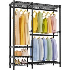 an iron rack with clothes and handbags hanging on the rails, in front of a white background