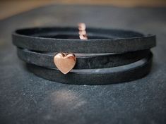 A black leather wrap bracelet with a beautiful rose-golden heart charm. It comes gift wrapped in a handmade Origami envelope and a colour matching organza pouch. A little handwritten note can be added for that extra personal touch.   It is 5mm wide and 51 - 54cm long (adjustable with a chain extender) The bracelet wraps around the wrist 3 times. The bracelet is made from real leather, can vary in texture and colour and has a nice "vintage effect". Also available in brown or tan leather. Bracelet Heart, Black Leather Bracelet, Chain Extenders, Moon Jewelry, Valentines Gifts For Her, Leather Wrap Bracelet, Swarovski Pearls, Boho Bracelets, Heart Bracelet