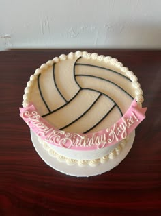 there is a cake that looks like a volleyball ball