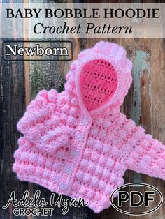 a pink crocheted sweater with a hoodie on it and the text baby bobble hoodie crochet pattern newborn