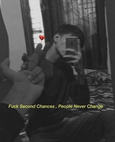 a man taking a selfie with his cell phone in front of him and the caption reads, f k second chance people never change