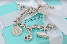 Tiffany & Co. Silver New York Themed Pretzel Apple Cab 7.5" Bracelet 100% Authentic Polished and Cleaned to Look New! Hallmark: Tiffany & Co. 925 Comes with Tiffany Pouch 30 Day Returns accepted! Pandora Bracelet Charms Ideas, Tiffany Jewelry, Pandora Bracelet Charms, Tiffany And Co, Fine Jewelry Bracelets, Pandora Bracelet, Tiffany Heart, Bracelets And Charms, Heart Charm Bracelet