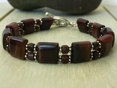 Mens Beaded Bracelet Red Tiger's Eye Silver Bracelet - Etsy Handmade Sterling Silver Brown Bracelet, Handmade Brown Sterling Silver Bracelets, Mens Onyx Bracelet, Designing Jewelry, Masculine Jewelry, Black Onyx Jewelry, Eye Bracelets, Beaded Leather Bracelet, Tiger Eye Jewelry