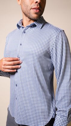 Now in a standout houndstooth pattern, the bestselling Andy Long Sleeve Shirt in Indigo boasts a cashmere-touch hand feel that gives an elevated take on your everyday shirt—a true chameleon no matter the vibe you’re going for. Layer up with your go-to outerwear or wear as is. Stylish plaid pattern Cashmere-touch fabric Double-sided brushed finish PRODUCT FEATURES Complementary color buttons Shirttail hem Leather icon label on placket and on back collar Golden neck seam piping with nylon inside b Touch Hand, Layering Hoodies, Polo Hat, Button Down Polo, Houndstooth Pattern, The Vibe, Complementary Colors, Zip Sweatshirt, Plaid Pattern