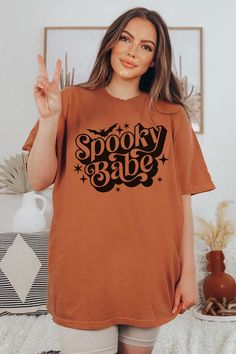 Spooky Season Shirt for Halloween Trick or Treat T-Shirt Product Details: ✿ Dreamy, Soft Fabric ✿ 100% Ring-spun Cotton ✿ Expertly Designed & Printed Sizing Details: ✿ Relaxed Fit  ✿ Size Up for Oversized Fit Recommended Care Practices: ✿ Cold Water Only ✿ Turn Inside Out to Wash ✿ Wash With Like Colors ✿ Tumble on Low Heat to Remove Wrinkles After Air Drying ✿ Do Not Iron Design Shipping & Processing: ✿ Please allow 2-7 business days for production. ✿ Please allow 2-7 business days for US Shipp Oversized Halloween Graphic T-shirt, Halloween Grunge T-shirt With Text Print, Trendy Halloween Text Print T-shirt, Trendy Halloween Tops With Text Print, Oversized Short Sleeve Halloween Tops, Spooky Oversized Top For Halloween, Halloween Relaxed Fit T-shirt With Letter Print, Oversized Spooky Top For Halloween, Oversized Spooky Tops For Halloween