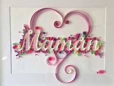 the word mama is made up of flowers and hearts in pink, green, purple, and white