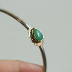 We are excited to offer this stunning Green Jade bracelet in solid 14K Solid gold and .925 Sterling Silver. Simple yet elegant bracelet and it's super easy to wear alone or stacked with other bracelets, and the green jade color is absolutely magnificent! The elegance of green jade is undeniable and elusive and in this dressy jade bracelet, it is no different. This green jade is particularly rich in its natural green majesty. We've surrounded the gorgeous green jade pear-shaped cabochon in Solid Formal White Gold Bracelet, 14k Gold Hallmarked Cuff Bracelet For Anniversary, Hallmarked 14k Gold Cuff Bracelet For Anniversary, Formal Yellow Gold Sterling Silver Bangle, Silver And 14k Gold Cuff Bangle, Silver 14k Gold Cuff Bangle Bracelet, Yellow Gold Sterling Silver Bangle For Formal Occasions, Sterling Silver Bangle In Yellow Gold For Formal Occasions, 14k Gold Polished Cuff Bracelet Gift