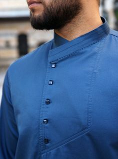 Cross-over mandarin collar Asymmetrical buttoned opening Model is 184cm (6 feet) and wearing size L Item Code: mQ0982 Traditional Stand Collar Top With Buttons, Fitted Blue Top With Stand Collar, Semi-formal Blue Buttoned Tops, Blue Casual Kurta For Eid, Casual Blue Kurta For Eid, Long Sleeve Blue Tops For Eid, Long Sleeve Kurta With Button Cuffs For Workwear, Classic Long Sleeve Kurta With Buttons, Casual Nehru Jacket For Work With Long Sleeves