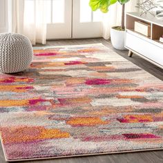 an area rug with various colors and shapes