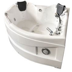 an oval shaped bathtub with two faucets on the sides and black handles