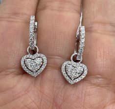 Beautiful heart shape dangle diamond earrings. You can wear the small hoops on its own also by removing the diamond heart dangle. Which is nice if you want to be super simple sometimes. The diamonds are all white and very sparkling. Good quality diamonds. The dangle is very pretty, not too long just below the lobe. Excellent craftsmanship on these earrings. Nice and secure clasp. Measures about 24 x 10.2mm. Wholesale price, Don't pay retail! Genuine natural round brilliant cut diamonds total wei Dangle Diamond Earrings, Diamond Hoop Earrings Small, Heart Diamond Earrings, Diamond Heart Earrings, Morganite Engagement Ring Halo, Gold Heart Earrings, Earrings White Gold, Gold Heart Earring, Earrings Dangling