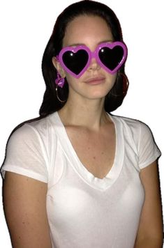 a woman wearing pink heart shaped sunglasses