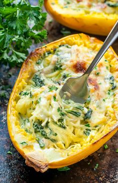 a close up of a casserole dish with broccoli and cheese in it