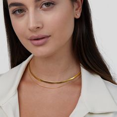 Finish off any look with this sleek and minimalist layered necklace. Beautifully designed to elevate any outfit effortlessly, this necklace is a must-have.  Made with waterproof stainless steel, you never need to worry about fading or tarnishing jewelry ever again! Waterproof & tarnish-free Stainless steel 18K gold Minimalist Everyday Layered Necklaces, Minimalist Double Chain Herringbone Necklace For Everyday, Layered Double Strand Minimalist Jewelry, Trendy Clavicle Chain Choker For Layering, Minimalist Layered Double Strand Jewelry, Dainty Herringbone Necklace For Layering With Clavicle Chain, Minimalist Layered Everyday Jewelry, Minimalist Double Chain Herringbone Necklace, Modern Delicate Chain Layered Necklace