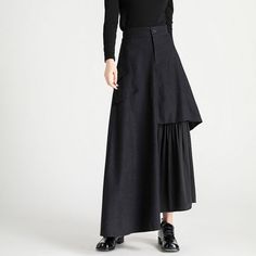 A long docking skirt with different fabrics spun together at the hem. It has a slender silhouette from the waist to the hips, but has a loose design that widens at the hem. The fragrant "black" makes its presence stand out. 
 
 
 Size 
 
 S size 
 
 Total length: 94cm 
 Waist: 64-68cm 
 Hip: 104cm 
 
 M size 
 
 Total length: 95cm 
 Waist: 68-72cm 
 Hip: 108cm 
 
 L size 
 
 Total length: 96cm 
 Waist: 72-76cm 
 Hip: 112cm 
 
 XL size 
 
 Total length: 97cm 
 Waist: 76-80cm 
 Hip: 116cm Black Patchwork Tiered Skirt, Black Tiered Patchwork Skirt, Fall Patchwork Asymmetrical Skirt, Black Asymmetrical Hem Pleated Maxi Skirt, Black Pleated Maxi Skirt With Asymmetrical Hem, Black Asymmetrical Pleated Bottoms, Black Asymmetrical Skirt With Layered Hem, Black Asymmetrical Voluminous Maxi Skirt, Black Asymmetrical Flowy Maxi Skirt