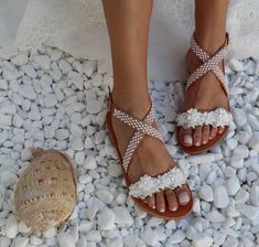 Handmade genuine Greek leather wedding sandals decorated with romantic ivory lace with pearls / The embellishments are hand sewn onto the leather straps / For brides dreaming of a beach wedding, a Bachelor party or even a city wedding. Full sizes only ** If you have half the size, go UP to the nearest full size ** If you are unsure of your size, please contact me so I can assist you. ★ More wedding sandals: https://www.etsy.com/listing/870914724/wedding-sandals-ancient-greek-sandals?ref=shop_hom Summer Wedding Pearl Open Toe Shoes, Summer Open Toe Pearl Wedding Shoes, White Pearl Wedding Shoes For Summer, White Pearl Open Toe Wedding Shoes, Summer Pearl White Wedding Shoes, Pearl White Summer Wedding Shoes, Cream Open Toe Sandals For Bridal Shower, Pearl Open Toe Sandals For Summer, Summer Pearl Open Toe Sandals