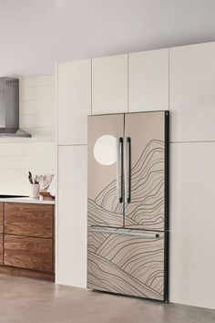 a modern kitchen with white cabinets and wood accents on the walls, along with stainless steel appliances