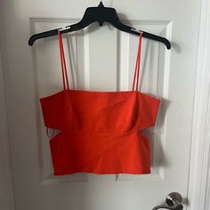 Nwt Super Cute Orange Cut Out Crop Tank From Zara. Size Xl, Would Recommend For A Large. Summer Cropped Tops With Cutout, Summer Cropped Cutout Tops, Spring Sleeveless Crop Top With Cutout, Spring Sleeveless Cutout Crop Top, Spring Cutout Crop Top, Sleeveless Cutout Crop Top For Summer, Sleeveless Cutout Beach Tops, Cropped Cutout Tops For Party, Spring Party Crop Top With Cutout