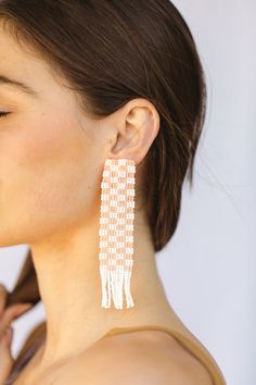 This Mary is all about how her garden grows. Our hand beaded checker print statement earrings with fringe detail on the bottom are perfect to be paired with our Evan hat, or a basic white t-shirt. available in peach plaid: our opaque peach with bright white - glass bead plaid statement earrings - made in Mexico - stainless steel post back - 4” length 1” width .75” tassels White Fringe Earrings For Summer, Chic Summer Fringe Jewelry, White Beaded Earrings For Spring, Trendy Fringe Earrings For Summer, Trendy Spring Jewelry With Fringe, Embroidered Art, Checker Print, Steel Post, Earring Patterns