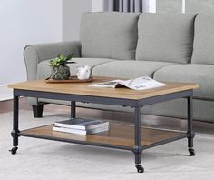 a living room with a gray couch and coffee table in the middle on carpeted flooring