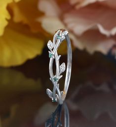 a close up of a ring with flowers on it