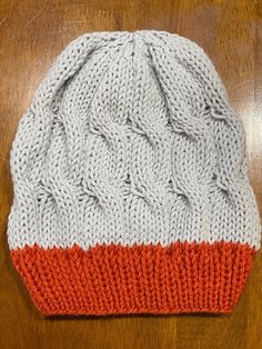 This lightweight beanie is knitted in Cable Knit  Slouchy Beanie style, that will help keep you warm during the chilly seasons. The light grey and tiger lily orange colors will add a pop any outfit in your wardrobe.  This beanie is knitted with love and the hope that you or whomever you gift it to will love it for years to come.  Easy care, wash on gentle and dry on low heat or allow to air dry. Part of the proceeds from this sale will go towards helping those in need in the Pacific Northwest Communities.  Thank you for your support in advance! Gray Acrylic Beanie Casual Style, White Casual Acrylic Beanie, White Acrylic Casual Beanie, Gray Knit Beanie One Size, Orange Casual Hat One Size, Casual Orange Hat One Size, Casual Orange Hat, Gray One Size Yarn Beanie, Warm Gray Yarn Beanie