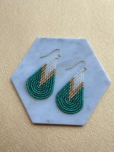 Vacation vibes, here we come! These beautiful teardrop earrings are hand-beaded using lightweight, sturdy materials such as iridescent seed beads that catch lots of light, thread and gold plated ear wires. Every pair comes with silicone clear backings.  Length: Approximately 2 inches Width: Approximately  If you would like to customize your pair using your favorite colors, please send me a message. I'd love to make a unique set, just for you! Vacation Jewelry, Funny Gifts For Her, Gifts For Beer Lovers, Vacation Vibes, Handmade Earrings Beaded, Earrings Turquoise, Red Jewelry, Teardrop Beads, Colorful Jewelry