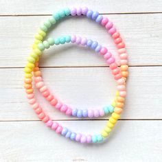 This ombre pastel bracelet is so adorable. It's stretchy and is cute on it's own or even better when stacked! 💗 Please check all selections and spelling prior to check out. Our custom bracelets are made to order so all sales are final. The bracelets are beautifully packaged and ready to gift. Receipts are never included. If you want to include a special note, please let me know in the comments. Roll, don't pull. To avoid excess stretching please roll the bracelet on and off. Treat and store the Cute Rainbow Stretch Bracelet For Friendship, Playful Multicolor Friendship Bracelets For Birthday, Playful Rainbow Stretch Bracelet For Friendship, Cute Multicolor Stretch Bracelet For Birthday, Sweet Adjustable Multicolor Bracelets, Cute Pink Plastic Friendship Bracelets, Adjustable Rainbow Stretch Bracelet For Birthday, Cute Pastel Bracelets For Friendship, Cute Adjustable Rainbow Stretch Bracelet