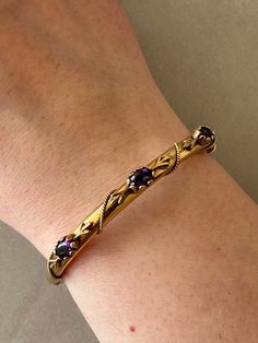 VINTAGE 14 KARAT AMETHYST ROPE BANGLE BRACELET ♥ ♡ ♥ ♡ ♥ ♡ ♥ ITEM DESCRIPTION:  Great condition! Such a special piece! ‣ Width: 5.5mm ‣ Weight: 13.6 grams  ‣ Measurments: 6cm x 5cm (when closed) ‣ Material: 14 Karat Yellow Gold, Amethyst  ‣ 14kt stamp on the inside of the piece  ‣ If you would like any additional details on the above item, we would be happy to help!!   ‣ All vintage items are professionally cleaned ♥ ♡ ♥ ♡ ♥ ♡ ♥ SHIPPING INFORMATION: ‣ Item comes with free tracked regular shippi Vintage Gold Bracelet, Gold Cuff Bracelet, Vintage Bangles, Gold Bracelet Cuff, Gold Cuffs, Vintage Bracelet, Amethyst Bracelet, Bracelet Vintage, Vintage Bracelets