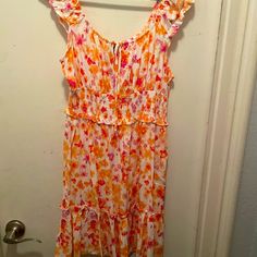 Never Worn White Dress With Colorful Flowers Of Oranges, Pinks, And Yellows. This Dress Is In A Size Large. White Ditsy Floral Print Dress, Spring White Sundress With Ditsy Floral Print, White Ditsy Floral Print Sundress For Spring, White Floral Sundress With Ruffles, White Floral Print Sundress For Vacation, White Ditsy Floral Print Dress For Daywear, White Floral Sundress For Garden Party, White Sundress With Ditsy Floral Print, White Ditsy Floral Sundress For Garden Party