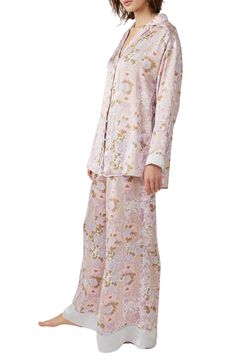 Make bedtime a bit more boho in flowery pajamas that live up to their dreamy designation. 28 1/2" to 31" top length; 28" inseam; 32" leg opening; 14" front rise; 17" back rise (size Medium) Top has spread collar; long sleeves 100% polyester Hand wash, line dry Imported Oversized Pajamas, Satin Pyjama Set, Bedtime Routine, Satin Pajamas, Print Pajamas, Mixing Prints, Black Satin, Oversized Fits, Pajama Set