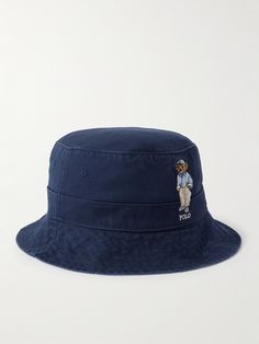 Ralph Lauren's bucket hat is embroidered with the iconic 'Polo Bear' decked out in a classic preppy get-up. It's made from 'Navy Blue Newport' cotton-twill and has a softly curved brim. Navy Cotton Hat With Embroidered Logo, Navy Casual Bucket Hat, Casual Bucket Hat With Embroidered Logo And Flat Brim, Navy Casual Bucket Hat With Short Brim, Navy Bucket Hat With Short Brim, Casual Navy Bucket Hat With Short Brim, Navy Flat Brim Cotton Hat, Navy Cotton Hat With Short Brim, Navy Cotton Flat Brim Hat