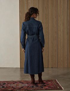 Timeless and versatile. Constructed from a 8.7oz denim, the classic twill surface is reminiscent of heritage denim with a soft, structured feel. At midi-length, it offers a flattering silhouette for all day wear. Features a full button front, chest pockets and hidden side pockets, a removable belt, contrast stitching, and long sleeves with cuffs. This dress effortlessly combines style and functionality. Classic twill denim, meticulously crafted for a timeless feel. Light enough for shirts or dre Denim Blue Fitted Midi Dress For Workwear, Fitted Denim Blue Midi Dress For Work, Classic Cotton Denim Dress With Button Closure, Classic Denim Dress For Workwear In Spring, Classic Denim Dress For Work With Button Closure, Denim Midi Dress With Pockets For Work, Classic Spring Denim Dress For Work, Denim Button-up Midi Dress For Work, Classic Denim Dress With Button Closure