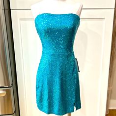 Nwt B. Darlin Blue Sequined Sweetheart Neckline Strapless Stretch Dress, Back Zip, Rubberized Strip Along Top Perimeter To Help Keep Top In Place, Flat Laid Measurements: Pit To Pit 16”, Waist 15”, Hips 18”, There Is Approximately 3” More For Stretch Allowance Fitted Sequin Strapless Dress, Glamorous Blue Mini Dress With Fitted Bodice, Blue Mini Dress With Straight Neckline For Party, Blue Strapless Dress With Straight Neckline For Evening, Blue Fitted Bodice Mini Dress For Homecoming, Light Blue Fitted Mini Dress For Prom, Light Blue Fitted Strapless Dress, Blue Strapless Dress With Sweetheart Neckline, Light Blue Strapless Dress For Prom Season