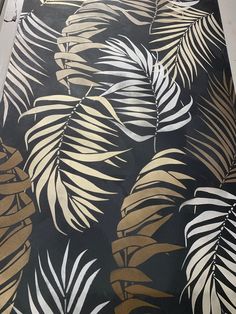 a black and gold palm leaf print rug