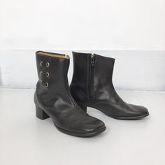 "60's brown vinyl ankle boots have a grommet/ lace detail on the shaft, and a faux shearling lining. The boots have as square toe, rubber stacked heel, textured rubber sole, and a talon side zipper on the inside shaft. Label is Bootinos by B.F. Goodrich. Condition Overall excellent, insole has slight matting from wear, but soles show very little wear. Measurements Insole 10.25 Width 3.5\" Heel height 2\" Would best fit a size 8 1/2, and tag size is a.n 8.1/2M." Womens Booties, Booties Ankle Boots, Cotton Lace, Stacked Heel, Boot Shoes Women, Lace Detail, Bootie Boots, 1960s, Heel Height