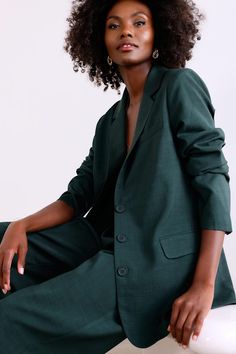 From brunch to the boardroom, prepare for compliments along the way in the Lulus Bold Poise Dark Green Button-Front Blazer! Lightweight stretch-woven fabric shapes this chic blazer with a collared neckline, notched lapels, and long sleeves with lightly padded shoulders and button cuffs. The slightly oversized bodice features a trio of functional buttons at the center, accompanied by two, functional flap pockets. Kick pleat at back. Pair with the matching pants for a complete look! Fit: This garm Tailored Button-up Blazer For Career, Spring Office Button-up Suit, Fall Single Button Blazer For Business Meetings, Spring Suit Collar Blazer For Business Meetings, Chic Green Single-button Blazer, Chic Green Single Button Blazer, Green Blazer With Hidden Buttons For Office, Green Office Blazer With Hidden Button Closure, Modern Business Casual Button-up Blazer