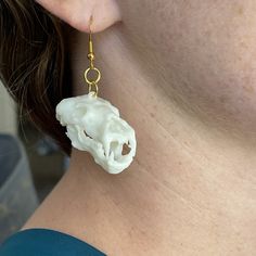 Hand modeled bear skull hypoallergenic dangle earrings. They have a good weight to them as they're resin.  There's a lot of detail in these. I don't paint them myself but I've had a lot of really impressive pictures sent to me by people that do. I have little mars, bone pigment, and other small details that make painting them with a wash or rub come out really nice.  Solid set of earrings to make a statement and have everyone asking about them. Bear Skull, Bear Earrings, Earrings Halloween, Gothic Earrings, Gold Dangle Earrings, Hand Model, How To Make Paint, Earrings Pendant, Small Details