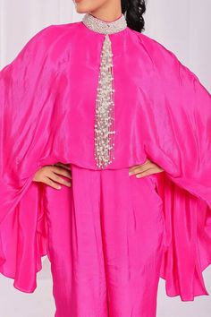 Hot pink padded cape jumpsuit with pearl tassel embroidery. - Aza Fashions Tassel Embroidery, Cape Jumpsuit, Cape Fashion, Jumpsuit For Women, Luxury Sale, Pink Jumpsuit, Modern Bride, Batwing Sleeve, Aza Fashion