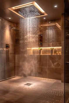 a shower head in the middle of a bathroom with brown tile walls and flooring