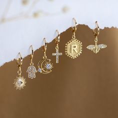 "Dainty Everyday Ear Stack Set, Personalized Initial Earrings, Evil Eye Cross Bee Hamsa Charm Huggies, bridesmaid gift, gold hoop earrings ✨These earrings feature a charm of your choice hanging from a dainty 18k Gold Plated huggie hoop. These hoops are sold as SINGLES, or by PAIRS - both options are available to select from the 2nd drop down menu. Mix & match these earrings to create fun and unique pairs! * Bezeled Moonstone Hoop Available to Purchase HERE: https://www.etsy.com/listing/125321249 Gold Plated Charm Earrings, Gold-plated Charm Earrings, Gold Plated Dangle Huggie Earrings As Gift, Gold Plated Dangle Huggie Earrings For Gift, Gold Dainty Hoop Earrings For Gift, Dainty Gold Hoop Earrings For Gift, Dainty Hoop Jewelry With Dangling Charms, Gold Dangle Huggie Earrings For Gift, Charm Dangle Earrings For Gifts