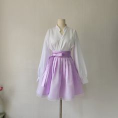 This is a Korean Modern Hanbok wrap style mini skirt for Women. This skirt is made of three layers, so it is beautiful without having to wear an underskirt with a natural voluminous feel. This hanbok is modernly designed so you can wear it comfortably and beautifully. This modern hanbok is perfect dress for daily and celebrations such as parties or various events. ⭐This skirt can be made in custom sizes. Please contact me if you would like to make your size. ⭐Please check out the link below for the white blouse in the photo. https://www.etsy.com/listing/1568387737/ ✔️Washing Method Dry cleaning is recommended for the first wash. Washable, please hand wash separately. Washing by twisting with excessive force may damage clothes. ⭐It can be matched with a variety of blouses top to create a be White Wrap Skirt For Spring Party, Korean Skirt Outfits, Hanbok Skirt, Hanbok Women, Modern Hanbok Dress, Casual Party Dress, Clothing Korean, Korean Skirt, King Outfit