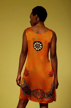 ACD23 - Nirvana (Orange/ Rust) Enter a room or outdoor event with the bold and vibrant colors of this orange/peach dress. The wearable art so distinct in red, blue, and green accents elevates this sleeveless dress to quality and beauty not found in any store. The combination of the life energy chakra, the uplifting birds, fish, and lotus blossom petals bring the energy and style you deserve to your active lifestyle. Relaxed and comfortable, you may wonder if you're even wearing a dress! The Slee Festival Sleeveless Silk Dress, Sleeveless Silk Festival Dress, Party Dress With Vibrant Orange Print, Fitted Orange Dress With Vibrant Print, Vibrant Orange Fitted Dress, Vibrant Fitted Orange Dress, Burrito Dress, Life Energy, Peach Dress